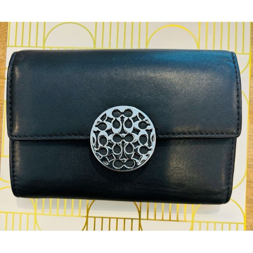 Coach Black Leather Bifold Wallet.. Not New.. only worn a few times..